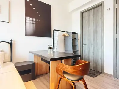 a bedroom with a desk and a chair next to a bed at Cozy Unit l Agile BB l 5min walk to TRX Pavilion in Kuala Lumpur