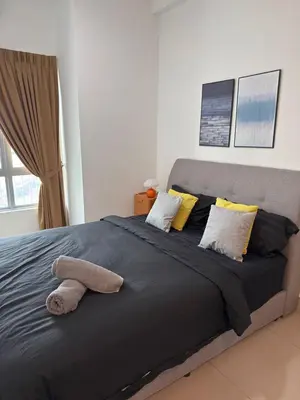 a large bed with two towels on top of it at Razak City Kuala Lumpur D4 09 in Kuala Lumpur