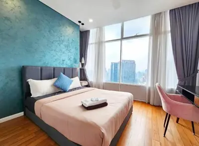 a bedroom with a large bed and a large window at Sky Suites Klcc By KD STAR Luxury Suites in Kuala Lumpur