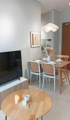a living room with a table and a dining room at Sky Suites Klcc By KD STAR Luxury Suites in Kuala Lumpur
