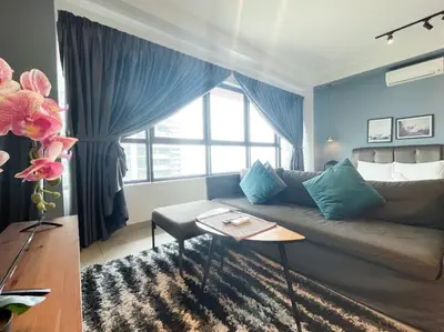 a living room with a couch and a large window at Arte Plus Ampang By Couple Stay in Batu Empat