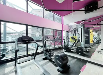 a gym with several treadmills in a building at Arte Plus Ampang By Couple Stay in Batu Empat