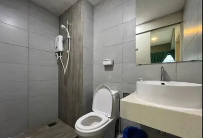 a bathroom with a white toilet and a sink at Arte Plus Ampang By Couple Stay in Batu Empat