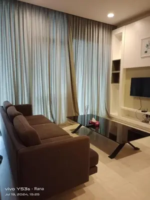 a living room with a couch and a television at Platinum Suites by Kuala Lumpur Malaysia in Kuala Lumpur
