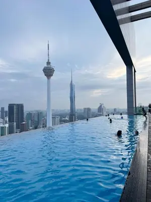 a infinity pool on the roof of a building with buildings at Platinum Suites by Kuala Lumpur Malaysia in Kuala Lumpur