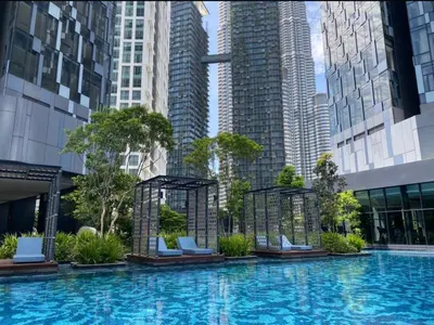 a large swimming pool in a city with tall buildings at One Star KLCC in Kuala Lumpur