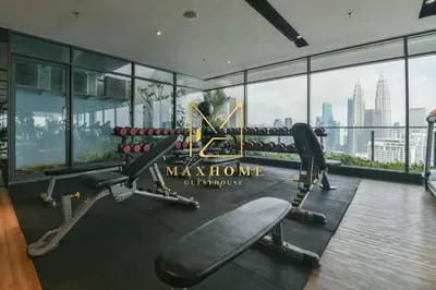 a gym with a view of the city at Maxhome Retreat at The Luxe in Kuala Lumpur