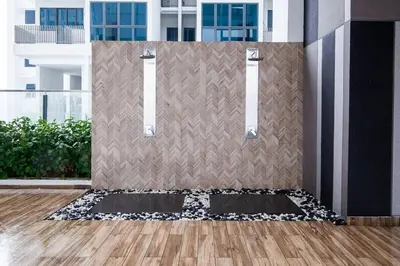 a room with a wall with a black and white rug at Maxhome Elite at The Luxe in Kuala Lumpur
