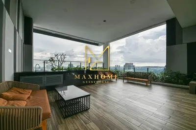 a large living room with a view of the city at Maxhome Elite at The Luxe in Kuala Lumpur
