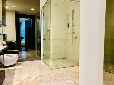 a bathroom with a glass shower and a toilet at Platinum Suites KLCC By Premium Hospitality in Kuala Lumpur