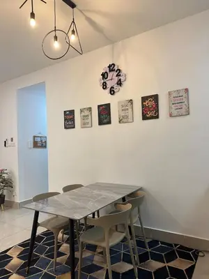 a dining room with a table and chairs at Anaqi Homestay by Razak City Sg Besi in Kuala Lumpur