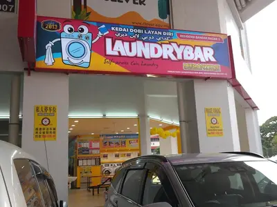 a car parked in front of a laundromat at Anaqi Homestay by Razak City Sg Besi in Kuala Lumpur