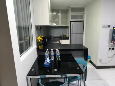 a kitchen with two bottles of water on a table at 08-3 Sweet Home-Casa Residency 3R 2B City View in Kuala Lumpur