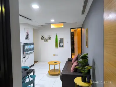 a living room with a couch and a table at 08-3 Sweet Home-Casa Residency 3R 2B City View in Kuala Lumpur
