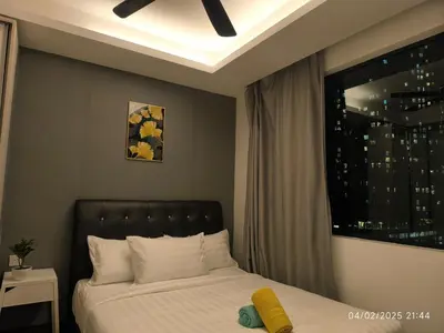 a bed in a room with a window and a bed sidx sidx sidx at 08-3 Sweet Home-Casa Residency 3R 2B City View in Kuala Lumpur