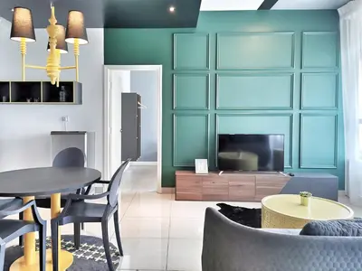 a living room with a table and a television at Arte Plus Ampang 2BR Private Lift Suite - Living Signature in Kuala Lumpur