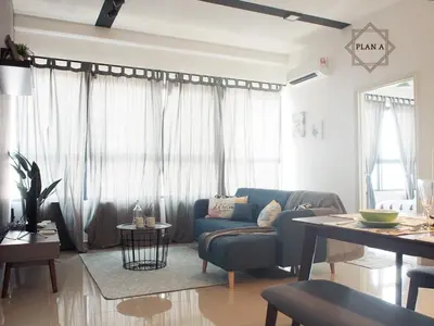 a living room with a blue couch and a table at Arte Plus Ampang 2BR Private Lift Suite - Living Signature in Kuala Lumpur