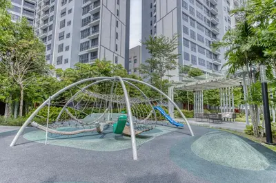 a playground in a park with tall buildings at Agile Residence Bukit Bintang, TRX by Isabella in Kuala Lumpur