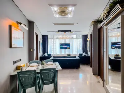a dining room with a table and chairs at Vortex Suites Klcc By VIP SUITES in Kuala Lumpur
