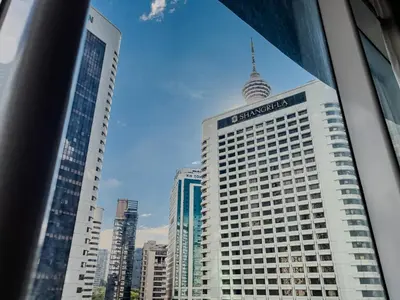 a view of a tall building in a city at Vortex Suites Klcc By VIP SUITES in Kuala Lumpur