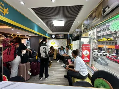 a group of people waiting for their luggage in a store at SS Grey Hotel kL in Kuala Lumpur