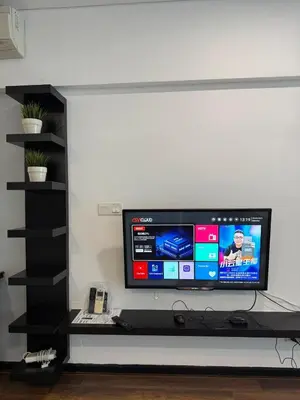 a tv sitting on a shelf in a room at Summer Suite KL City Balcony Room KL Tower View in Kuala Lumpur