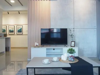 a living room with a tv and a coffee table at Arte Plus Ampang 2BR Family Suite - Living Signature in Kuala Lumpur