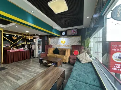 a lobby with a couch and chairs in a store at SS Grey Hotel BB in Kuala Lumpur