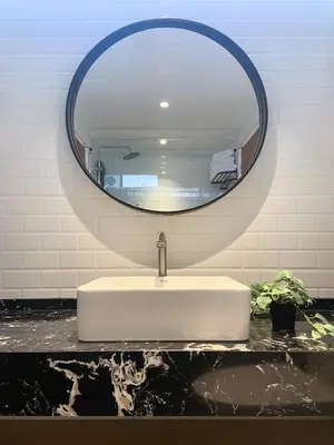 a bathroom sink with a large mirror above it at Fahrenheit88 Opposite Pavilion KL Bukit Bintang in Kuala Lumpur