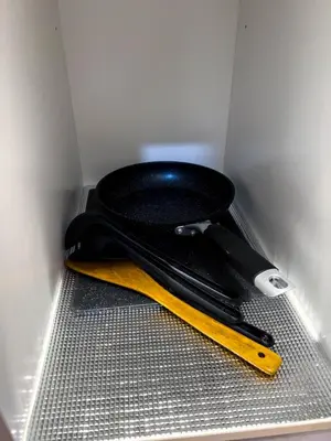 a black toilet in a corner of a room at Premier Stay KL - Bangsar South - King Bed - Work Space - Near LRT, VE, Conexxion in Kuala Lumpur