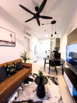 a living room with a couch and a ceiling fan at Premier Stay KL - Bangsar South - King Bed - Work Space - Near LRT, VE, Conexxion in Kuala Lumpur