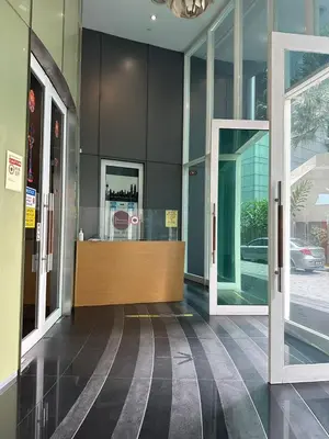 an entrance to a building with two glass doors at Vortex klcc by Elham in Kuala Lumpur