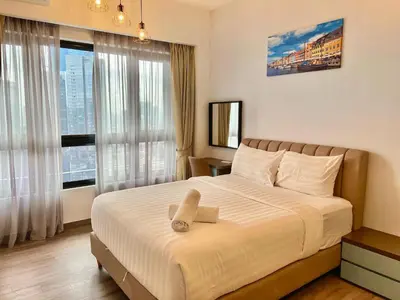 a bedroom with a bed and a large window at Agile Bukit Bintang By Comfort Suites in Kuala Lumpur