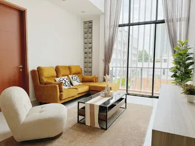 a living room with a couch and a table at 68 Palms 04 l Midvalley l 6 Pax in Kuala Lumpur
