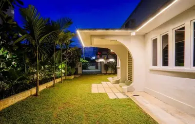 an external view of a house with a yard at 68 Palms 04 l Midvalley l 6 Pax in Kuala Lumpur