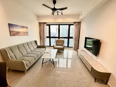 a living room with a couch and a flat screen tv at Agile Bukit Bintang By Well Shaped in Kuala Lumpur
