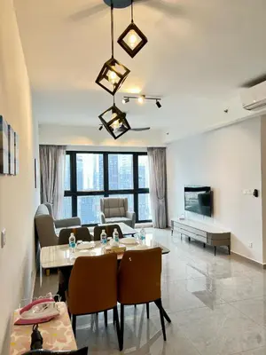 a living room with a table and a couch at Agile Bukit Bintang By Well Shaped in Kuala Lumpur