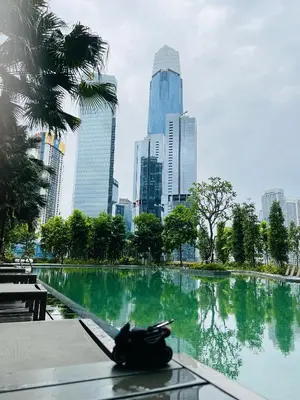 a fountain in a park with a city in the background at Agile Bukit Bintang By Well Shaped in Kuala Lumpur