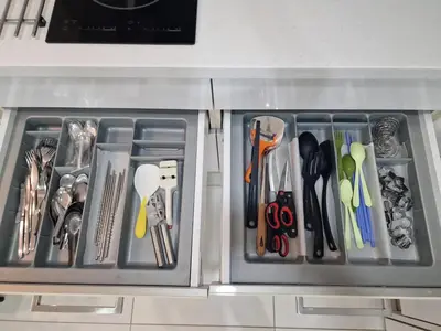 a drawer with scissors and other utensils in it at Summer Suites Klcc 2BR Apartments by ATIQ in Kuala Lumpur
