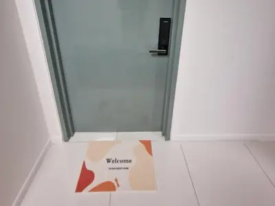 a welcome mat in front of a door at Summer Suites Klcc 2BR Apartments by ATIQ in Kuala Lumpur