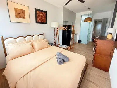 a bedroom with a bed with a hat on it at Cozy Studio l Riveria City l 1km to KL Sentral in Kuala Lumpur