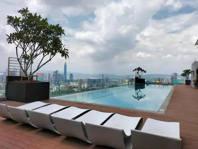 a swimming pool on the roof of a building at Cozy Studio l Riveria City l 1km to KL Sentral in Kuala Lumpur