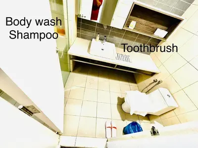 an overhead view of a bathroom with a sink at The Roberstson family suite with city views in Kuala Lumpur