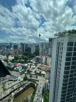a view of a city with a tall building at The Roberstson family suite with city views in Kuala Lumpur