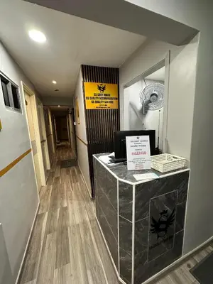 a hallway with a reception desk in a building at SS GREY HOUSE Jalan Alor in Kuala Lumpur