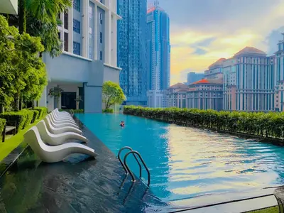 a swimming pool in a city with tall buildings at The Mews Suites KLCC By Luna in Kuala Lumpur
