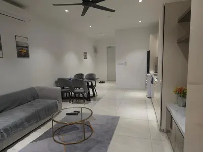 a living room with a couch and a table at Quill Residence KL Suites in Kuala Lumpur
