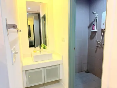 a bathroom with a sink and a shower at Mercu Summer Suites KLCC By Suite Apartment in Kuala Lumpur