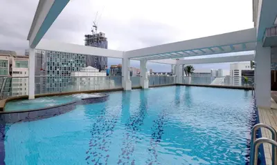 a large swimming pool on the roof of a building at Parkview Serviced Apartment Kuala Lumpur Twin Tower in Kuala Lumpur
