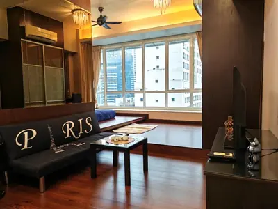 a living room with a couch and a table at Parkview Serviced Apartment Kuala Lumpur Twin Tower in Kuala Lumpur